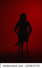  Silhouette Of Woman Sitting On Chair