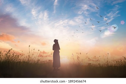 Silhouette Woman Standing With Birds Flying On Abstract Of Earth And Heaven Background