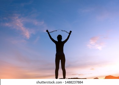 Silhouette Woman Standing On Mountain And Breaking Metal Chains, Freedom Concept