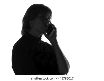 Silhouette Of A Woman Talking On The Phone