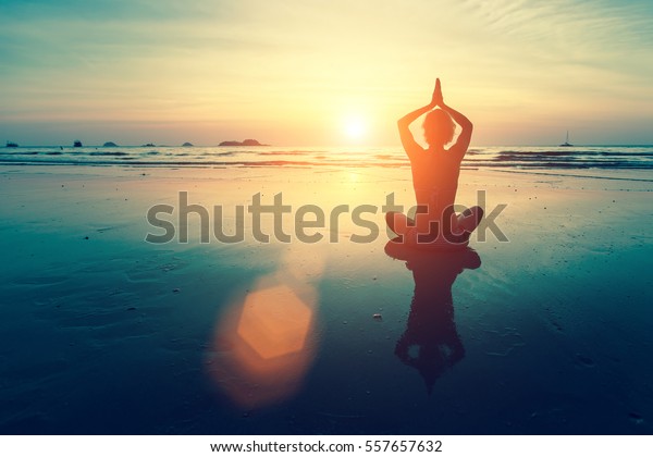 Silhouette Woman Yoga On Ocean Beach Stock Photo 557657632 | Shutterstock