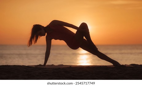 Silhouette of a woman in a yoga pose during sunset on a beach. The tranquil setting and serene atmosphere make this a perfect concept for wellness, relaxation, and mindfulness content. - Powered by Shutterstock