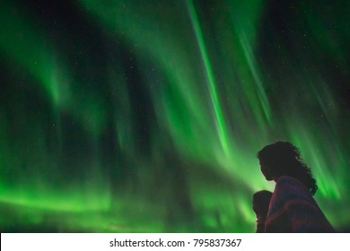 Silhouette Of Womans Looking At The Northern Lights Over Drammen