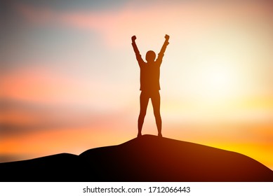Silhouette women standing raise both hand with sunset blurry background. Concept of freedom, Success of life. Business and organization goal. Travel and adventure concept 