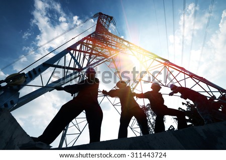 silhouette workers on background of construction