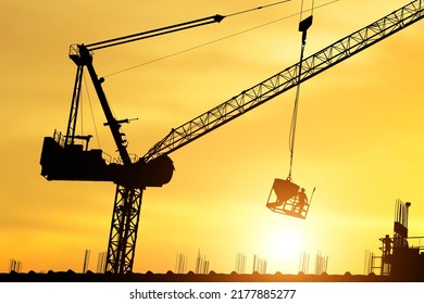 Silhouette Of Workers Working At A Construction Site, Construction Workers Work In Preparation For Binding Rebar And Concrete Work.