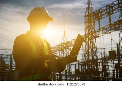 Silhouette Of Working Engineer In The Construction Site.