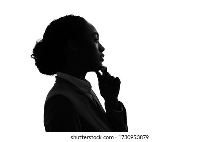 Silhouette of young black woman thinking something.