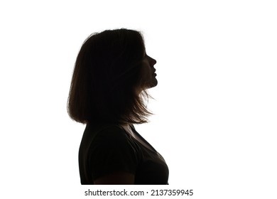 Silhouette of young black woman thinking something. - Powered by Shutterstock