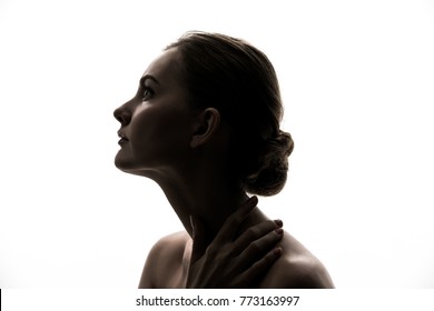 Silhouette of young caucasian woman.
