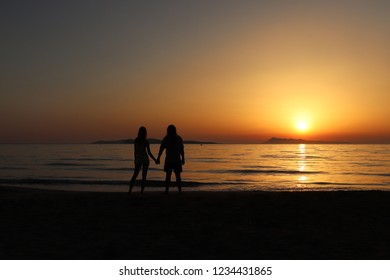 A Silhouette Of A Young Couple. Location: Europe, Greece, Corfu