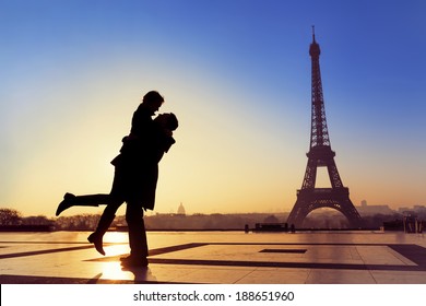 Silhouette of young couple in love with Eiffel Tower background in Paris, France