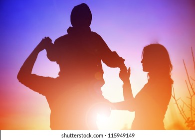 Silhouette Of A Young Family