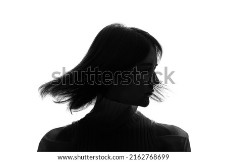 Silhouette of young half Latina and half Asian woman. Hair care concept.