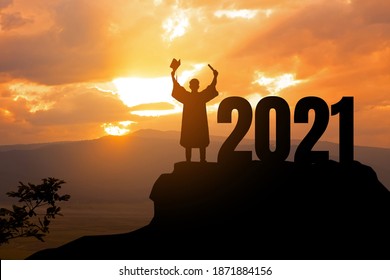 Silhouette Young Man Graduation In 2021 Years, Education Congratulation Concept ,Freedom And Happy New Year, Copy Space.