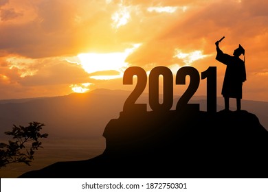 Silhouette Young Man Graduation In 2021 Years, Education Congratulation Concept ,Freedom And Happy New Year, Copy Space.