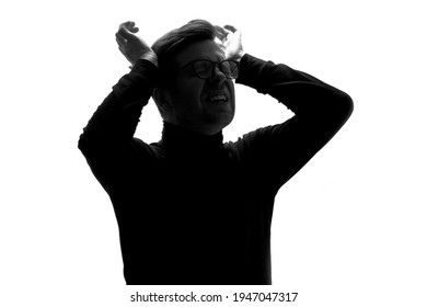 Silhouette of young man having headache pressing with hands on temples isolated over white background.