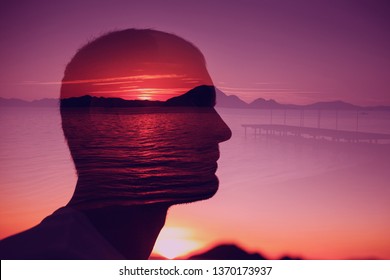 Silhouette Young Man On Background Of Sunset Over The Sea. Multiple Exposure. Creative Ideas, Peace Emotions, Abstract Thinking Concept.