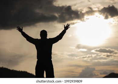 Silhouette Young Man Raised Hand Air Stock Photo 1992939809 | Shutterstock