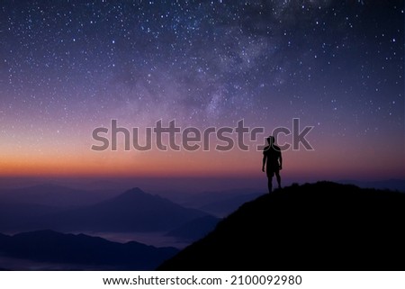 Image, Stock Photo People hiking at night. Mountains at sunrise. Man standing on peak. Natural mountain landscape with illuminated misty peaks, foggy slopes and valleys
