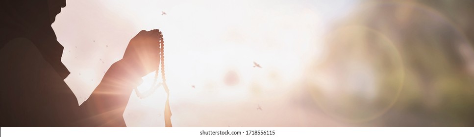 Silhouette Young muslim woman hijab honesty pray to God on sunset panoramic mosque background concept for eid mubarak, life and spiritual of islam girl fasting in ramadan, Indonesian civilian people