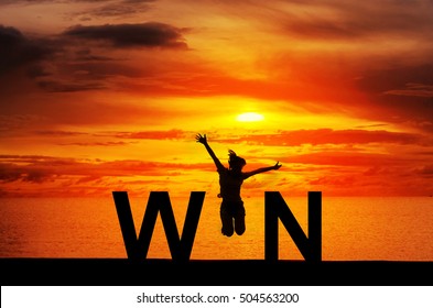 Silhouette young woman jumping on the beach and WIN message, Win concept, celebrating businesswoman success and goals sport exercising and working out.