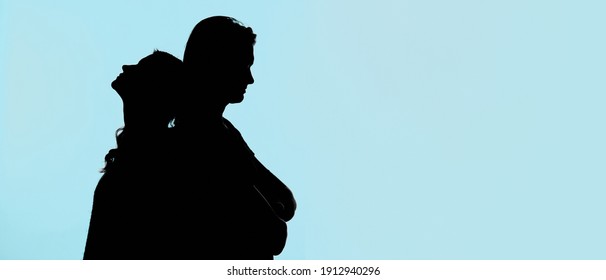 The silhouette of a young woman who loves each other on an isolated blue-green background with a copy of the text space. Horizontal banner for the design
