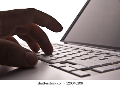 Silhouetted Image Someone Typing On Laptop Computer Symbol  Shadow Economy Illegal Operations Cracking Computer Passwords Fraud Hacking Advertising Sales Illegal Non Payment  Taxes Concealment Income