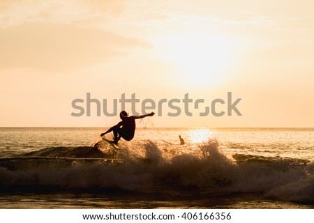 silhouetted image of a surfer showing good performance of arial maneuver