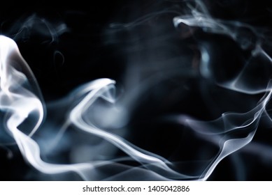 Silhouetted Smoke Wafting From Incense Burner / Candle, Lit and Isolated on Black Background. Some with intentional blur / motion to add to the abstract flowing image. - Shutterstock ID 1405042886