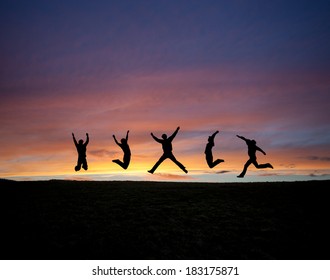 silhouetted teens jumping in sunset sky  - Shutterstock ID 183175871