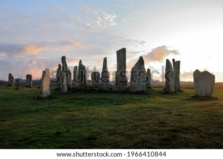 Silhouettes of the 5,000 years old  Neolithic era Callanish Stones on sunset near the village of Callanish (Calanais) on the west coast of Lewis in the Outer Hebrides, Scotland, UK