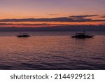 Silhouettes of boats in Moalboal, Cebu island, Philippines