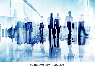 Silhouettes Of Business People In Blurred Motion Walking