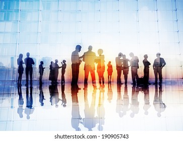 Silhouettes of Business People Discussing Outdoors