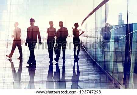 Silhouettes of Business People Walking in the Office