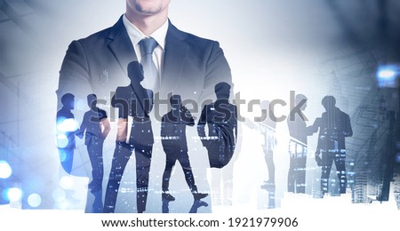 Silhouettes of business people working at corporate office in downtown. Work hard and business development concept. Double exposure
