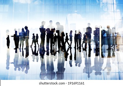 Silhouettes Of Business People Working In An Office