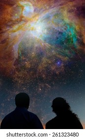 Silhouettes Of Couple Looking At Stars. Starry Night Sky With Colorful Galaxies, Astronomical Background With Place For Your Text.Elements Of This Image Furnished By NASA.