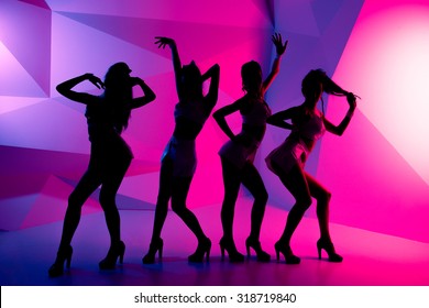 silhouettes of dancing girls