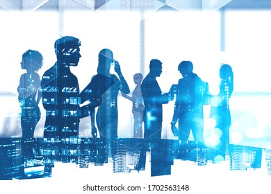 Silhouettes Of Diverse Business People In Blurry Panoramic Office Meeting Room With Double Exposure Of Night Cityscape. Concept Of Communication And Teamwork. Toned Image