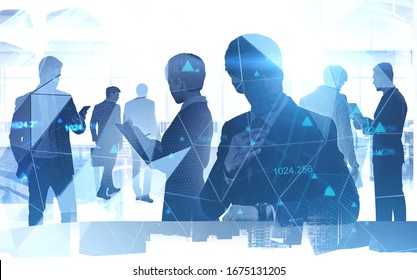 Silhouettes of diverse business people working together in blurry office with double exposure of cityscape and network hologram. Concept of internet connection and teamwork. Toned image - Powered by Shutterstock