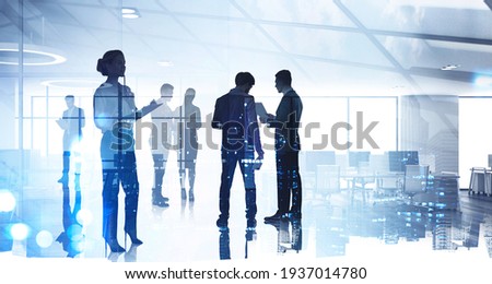 Silhouettes of diverse business people working together, toned image of office interior and skyscrapers. Concept of modern office with managers, partners