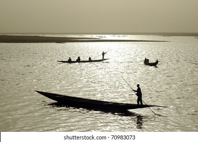 Silhouettes Of Fishermen In West Africa