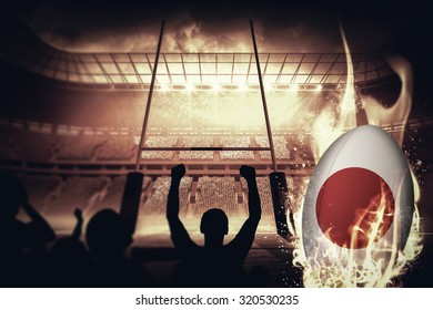 Silhouettes of football supporters against rugby pitch - Powered by Shutterstock