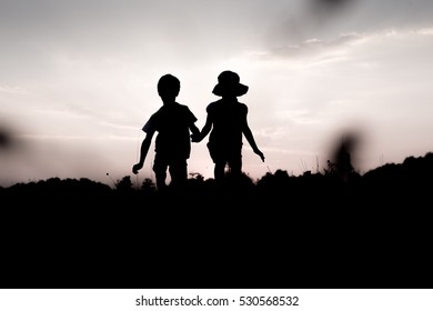 Silhouettes Kids Jumping Off Cliff Sunset Stock Photo 530568532 ...