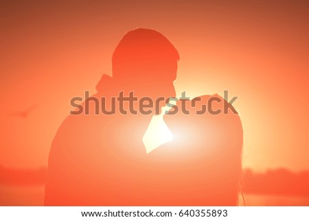 Similar – Two people watching the sunset