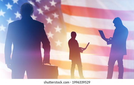 Silhouettes of a man on background of American flag. Concept lobbying for business in USA. Lobbyists with laptops. Lobbying Interests in USA. Promotion of interests in political community USA.