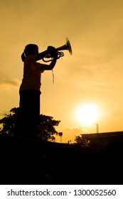 Silhouettes Mellophone Player Sunset Background.