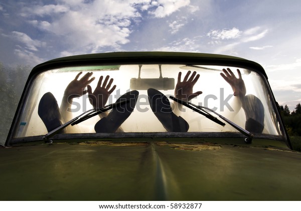silhouettes of
passengers in car full of
smoke